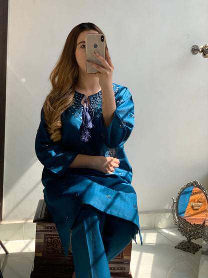 "Premium quality 2-piece stitched dress featuring intricate mirror embroidery."