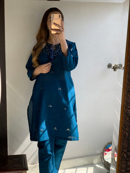 "Premium quality 2-piece stitched dress featuring intricate mirror embroidery."