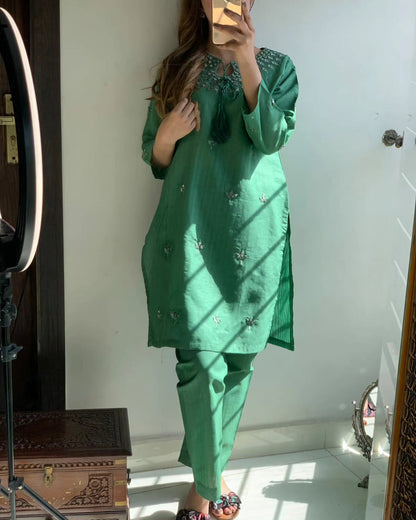 "Premium quality 2-piece stitched dress featuring intricate mirror embroidery."