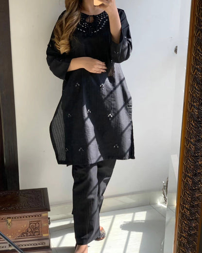 "Premium quality 2-piece stitched dress featuring intricate mirror embroidery."