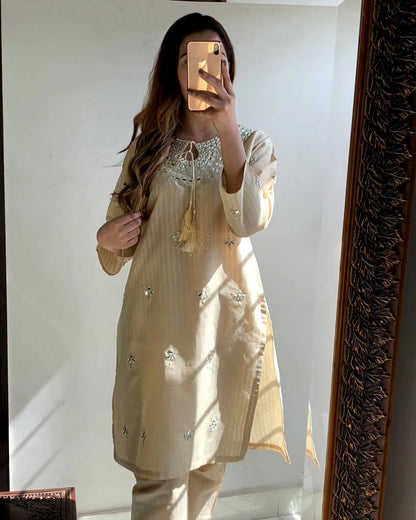 "Premium quality 2-piece stitched dress featuring intricate mirror embroidery."